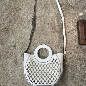 Cream/white purse with tan zipper pouch inside